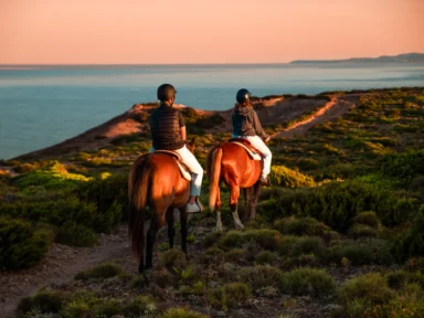 Horseback riding along the coast of Sant'Antioco at sunset