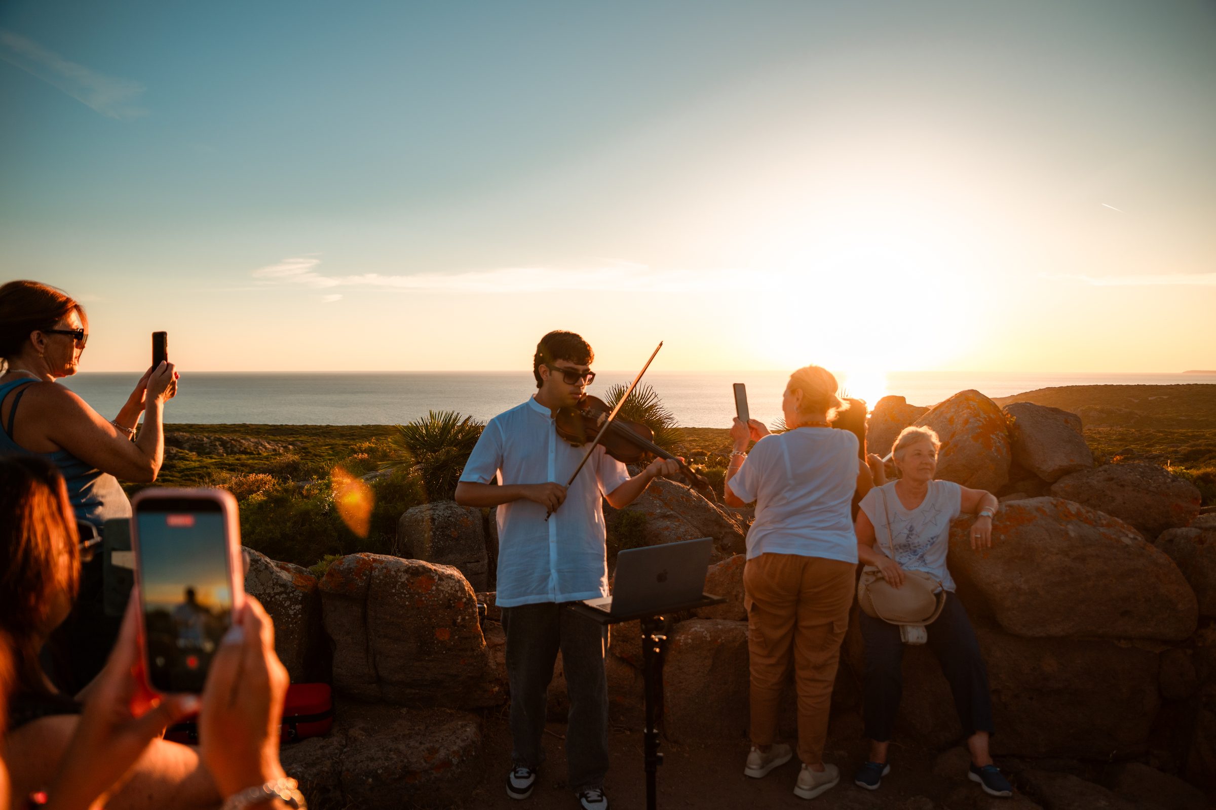 Live music by the sea at sunset during From Sunset to the Stars